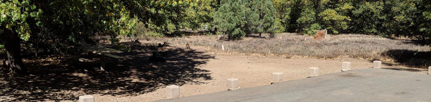 Burnt Rancheria Campground Site #17 featuring entrance to the wooded site and camping space. 